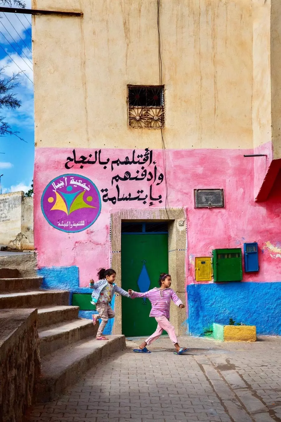 Moroccan girls playing in the colourful streets of Morocco