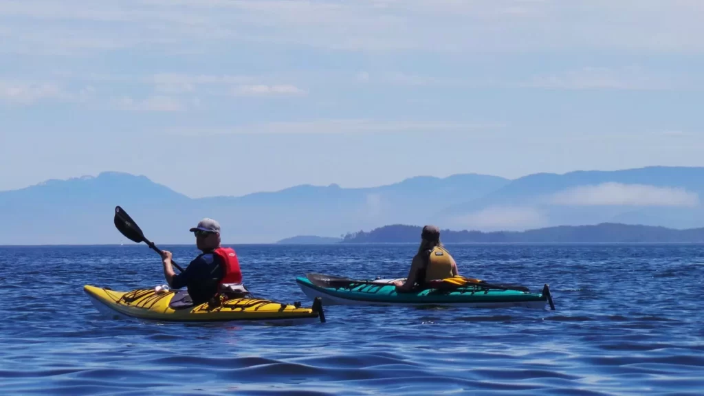 kayakers in the distance on the see kayaking adventure - Broken Group Islands BC