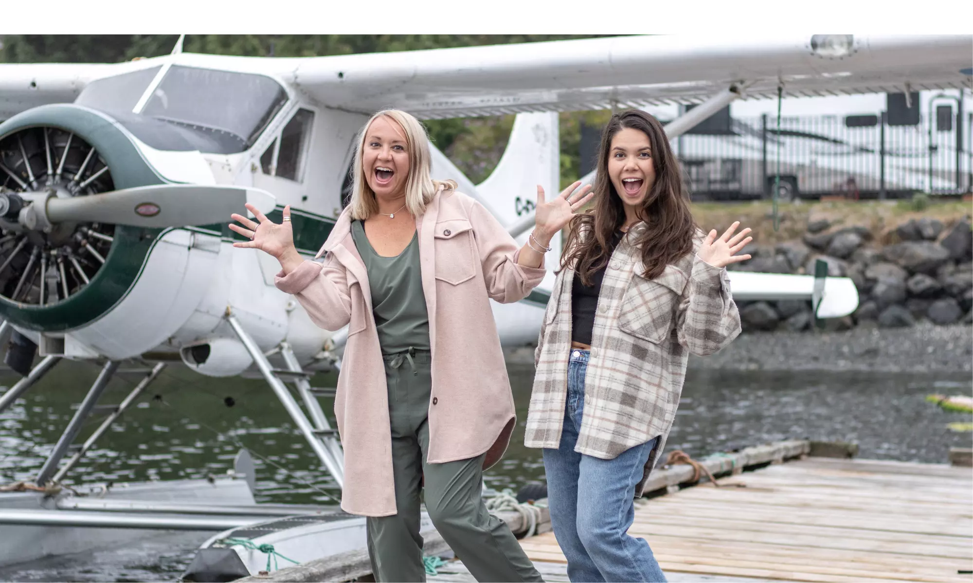 Image of Keri and Nicola in front of a plane smiling